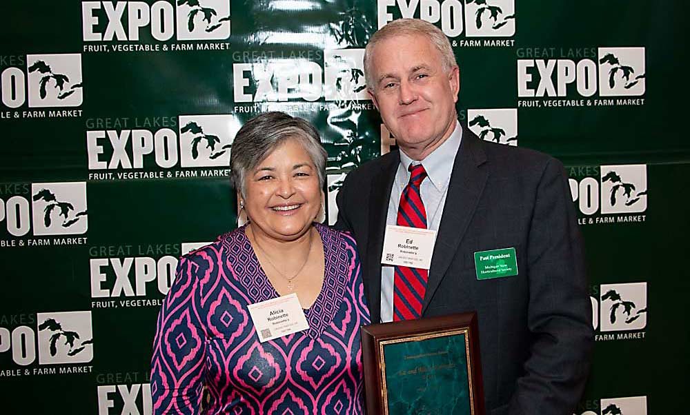 Ed and Alicia Robinette were given a Distinguished Service Award at the 2019 Great Lakes EXPO. (Matt Milkovich/Good Fruit Grower)