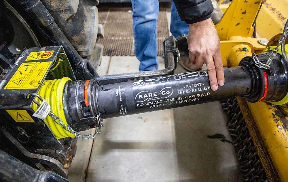 Drivetrain sleeves between tractors and towed equipment must not have holes that expose the spinning shaft. (Ross Courtney/Good Fruit Grower)