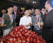 Jack Ma, in white, and Washington Apple Commission Shanghai rep Victor Want, right, during Alibaba’s T-Mall.com "Singles Day" celebration. (Courtesy Washington Apple Commission)