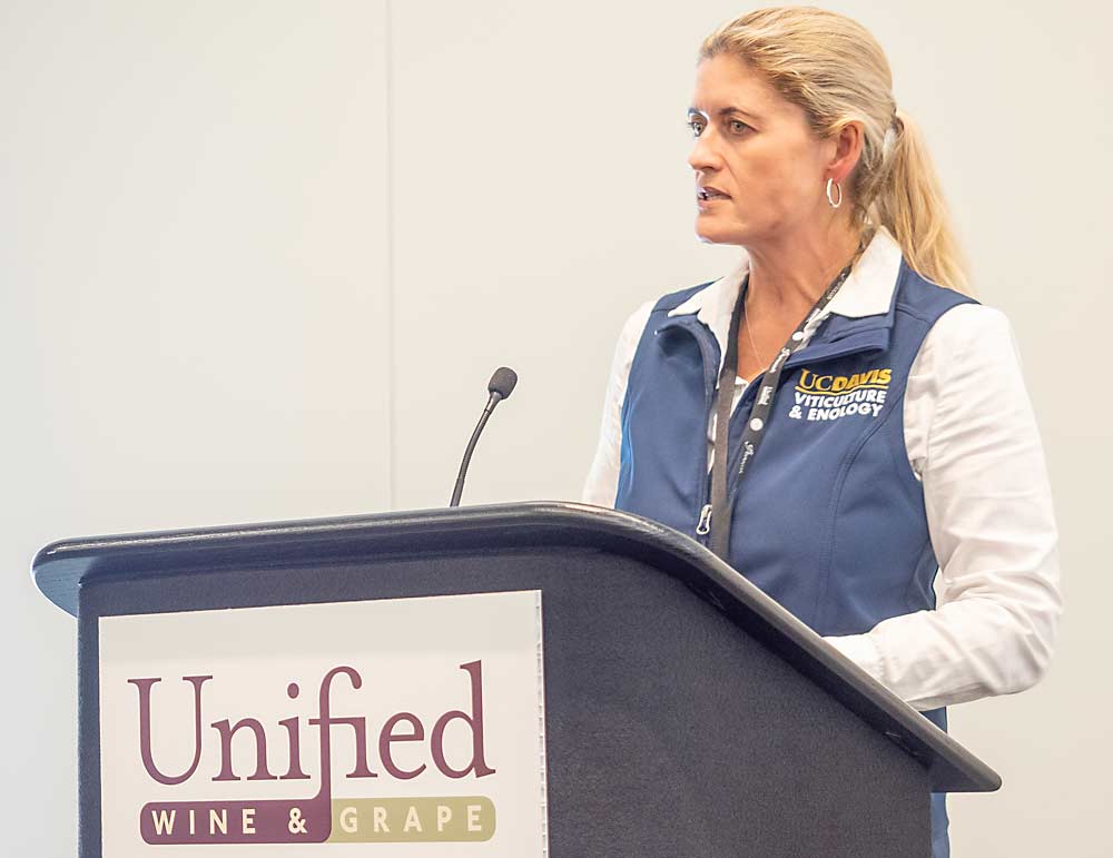 Anita Oberholster, enology extension specialist at University of California, Davis, shares updates on the latest research into smoke impacts on wine grapes, speaking at the Unified Wine and Grape Symposium in Sacramento, California, in late January, during a session that focused on strategies for growers and wineries living with the uncertainty that smoky skies can create. (Kate Golden/for Good Fruit Grower)