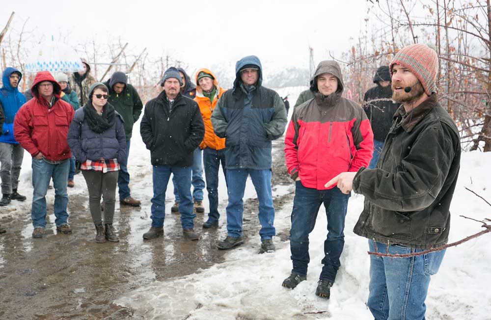 Jake Robison talks about succession planning and transitioning to new varieties during the International Fruit Tree Association tour at his family’s Chelan, Washington, orchards in February. (TJ Mullinax/Good Fruit Grower)