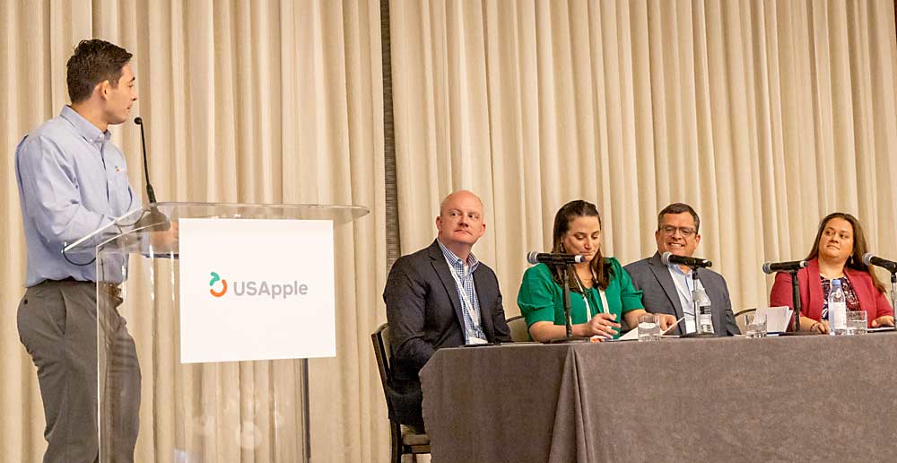 Mitchell Liwanag of the U.S. Apple Association, far left, moderates a panel on sustainability during USApple’s Outlook conference in Chicago in August. Sitting from left are Jamie Kober of Riveridge Produce Marketing, Amy Tranzillo of AgroFresh, Mike Preacher of Domex Superfresh Growers and Lex Roberts of Rice Fruit Co. (Matt Milkovich/Good Fruit Grower)