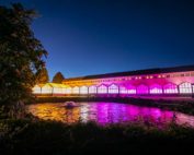 The U.S. Department of Agriculture, Agricultural Research Service building in Wapato, Washington, is illuminated with greenhouse lights. Although this facility is just 24 years old, ARS scientists have been stationed in the Yakima Valley for 100 years. (TJ Mullinax/Good Fruit Grower)