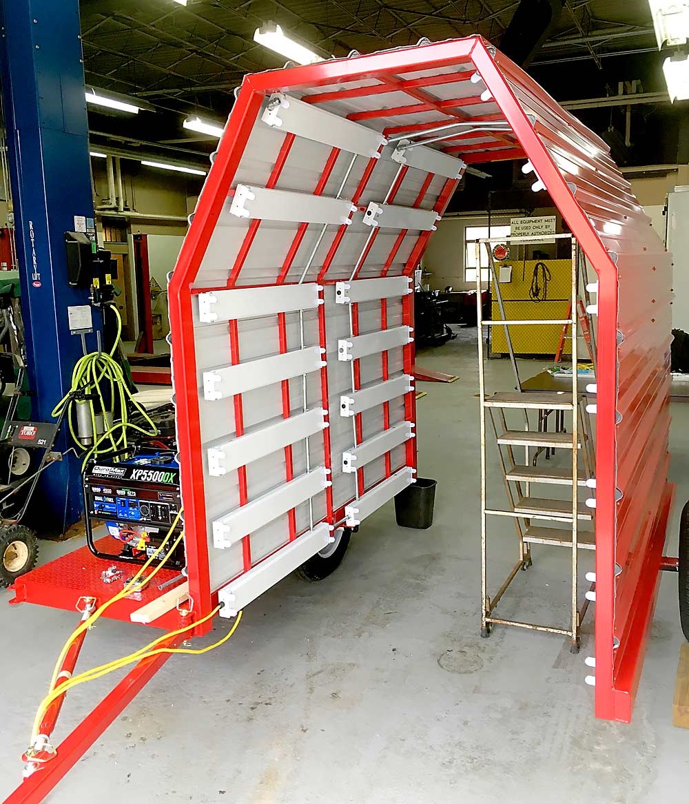 The arch is made of thin, reflective aluminum, and the inside is lined with UV-C bulbs. Cornell researchers are developing a production manual that anyone can use to make their own unit. (Courtesy Kerik Cox/Cornell University)