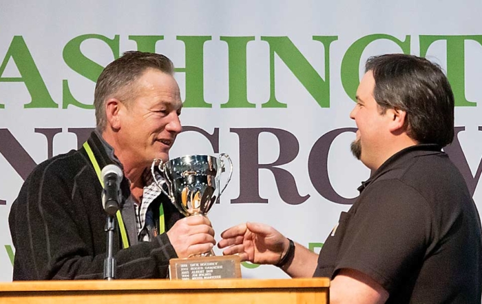 Jim McFerran, left, receives the Erick Hanson Memorial Winegrape Grower of the Year Award. (TJ Mullinax/Good Fruit Grower)