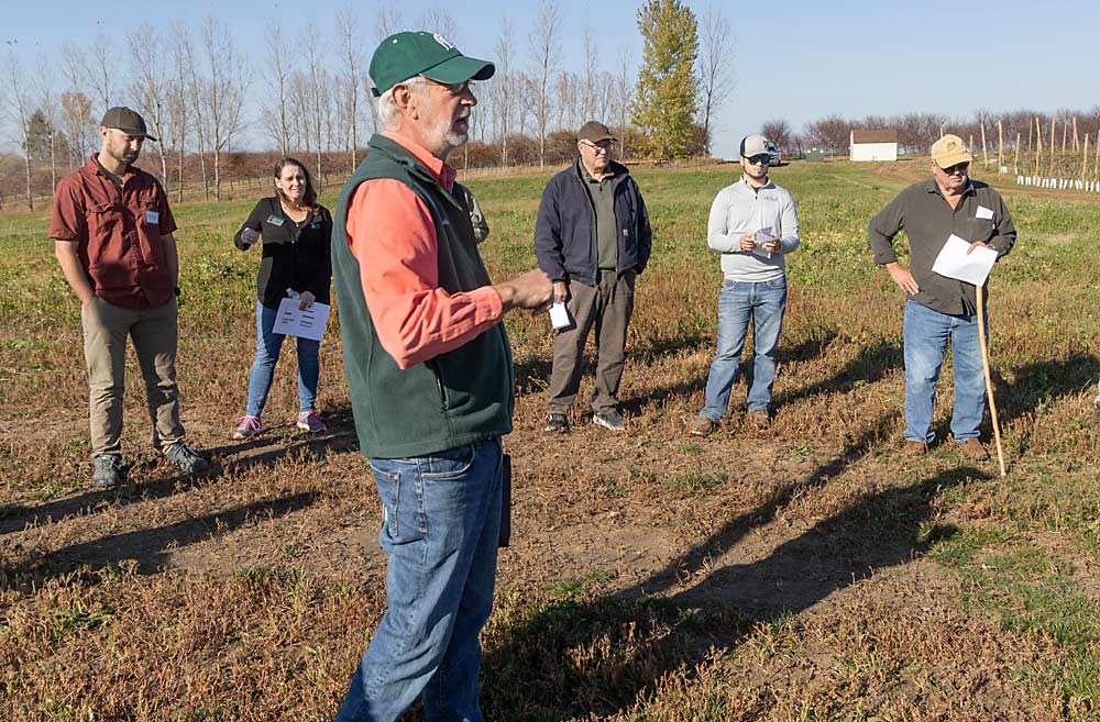 John Bakker, interim orchard manager at the West Michigan Research Station, discussed alternative trellis materials. He said there are promising alternatives to pine posts, but more research needs to be done. (Matt Milkovich/Good Fruit Grower)