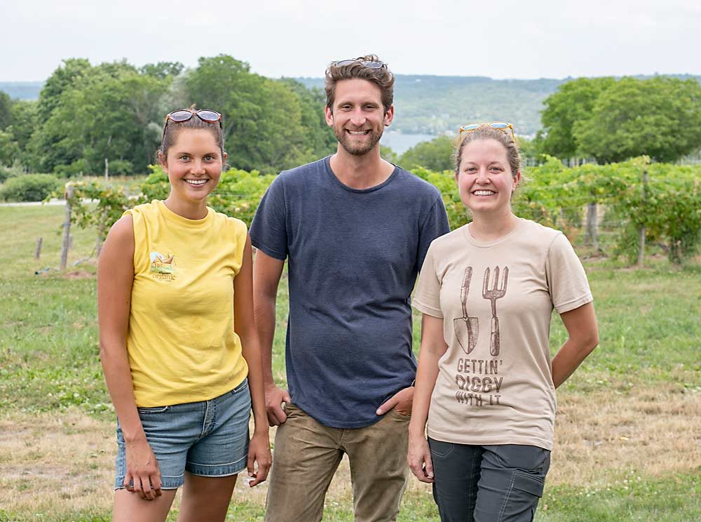 Wegmans organic employees, from left, Kaitlin Voellinger, Mark Bowker and Jessica Crabtree, at the company’s organic farm. (TJ Mullinax/Good Fruit Grower)