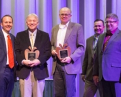 Charlie Pomianek and Kirk Mayer is presented with Distinguished Service Awards during the 112th Annual Meeting and Northwest Hort Expo banquet on December 6, 2016 in Wenatchee, Washington. From left, West Mathisson, Pomianek, Mayer, José Ramirez and Sam Godwin. (TJ Mullinax/Good Fruit Grower)