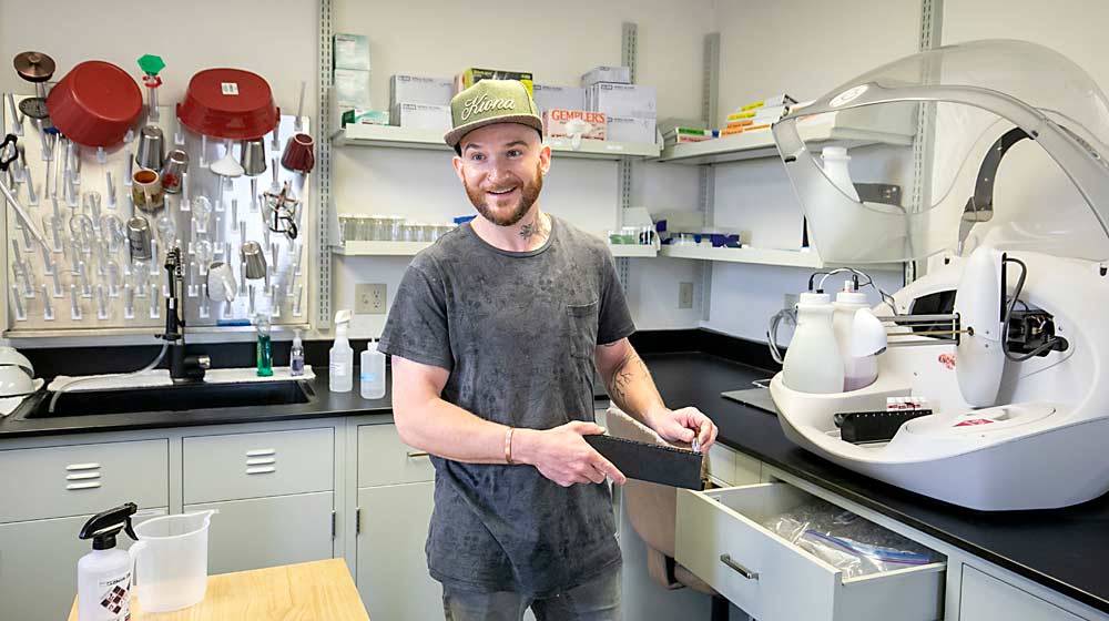 Tyler Williams joined the family business in 2019, after earning his master’s degree in wine science from Washington State University. He immediately set about remodeling the lab and bought this clinical analyzer, which allows him to do far more testing in house, bringing down the per-test cost from $30 to $1. (TJ Mullinax/Good Fruit Grower)