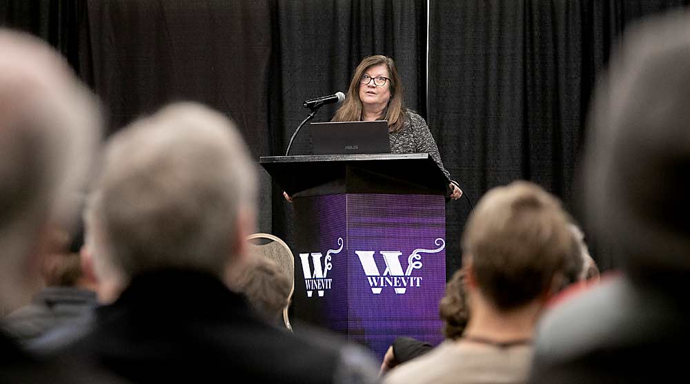Kristina Kelley, executive director of the Washington State Wine Commission, speaks about the industry’s strategic plan during the 2024 WineVit convention and trade show in February at the Three Rivers Convention Center in Kennewick. (TJ Mullinax/Good Fruit Grower)