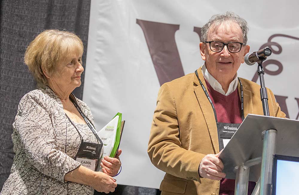 Carol and Vince Bryan, founders of Cave B Estate Winery, receive the Lifetime Achievement award during the Washington Winegrowers Association's 2022 WineVit convention on Feb. 10, at the Three Rivers Convention Center in Kennewick, Washington. (TJ Mullinax/Good Fruit Grower)