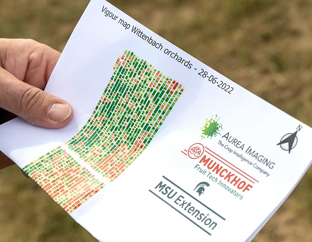 Han Smits holds a map of the Gala block at Wittenbach Orchards. Drone footage was used to measure tree vigor within the block in June. The red zones represent low-vigor trees, while green areas indicate trees with greater vigor. (Matt Milkovich/Good Fruit Grower)