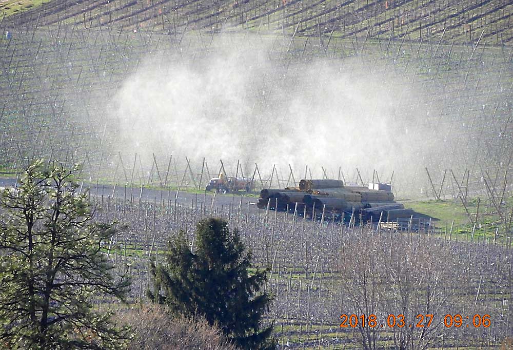Dormant season sprays can pose a high risk for drift if applicators fail to adjust sprayers to the canopy size, as seen in this photograph taken by a WSDA inspector in March 2018. (Courtesy Washington State Department of Agriculture)