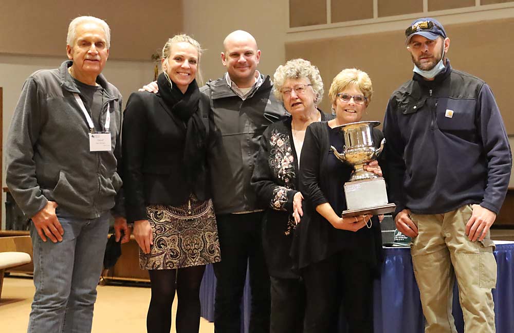 The family of Albert Don, a longtime vineyard manager at Wyckoff Farms, accepts on his behalf the Walter Clore award, given in recognition for his service to the grape industry. Don died unexpectedly in February 2021. (Kate Prengaman/Good Fruit Grower)