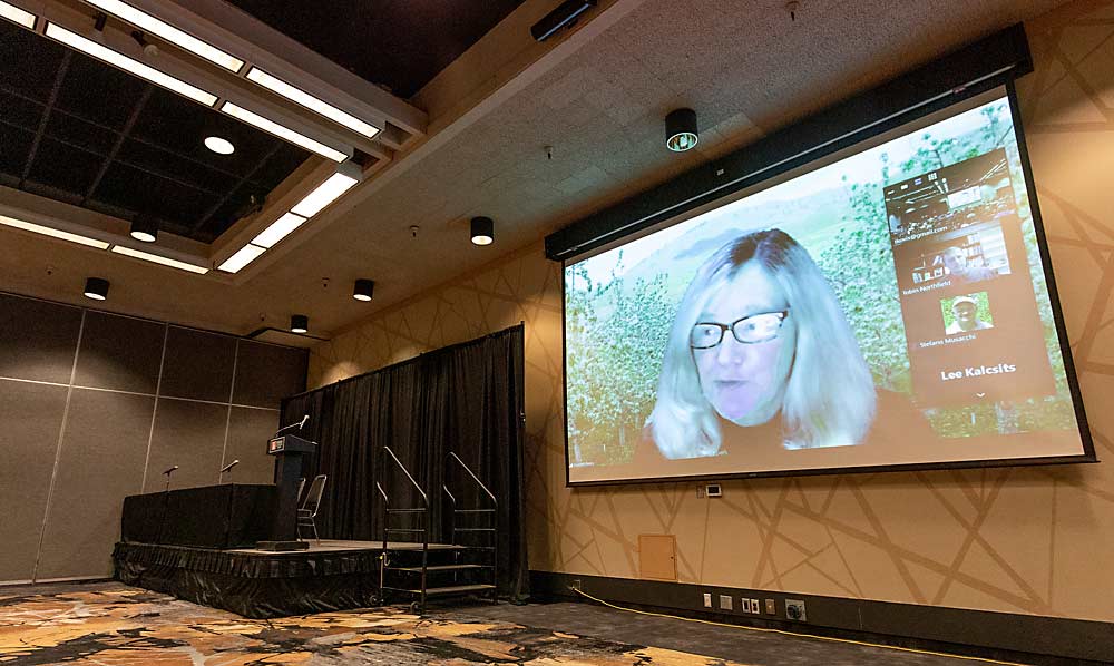 Betsy Beers, Washington State University Tree Fruit Research and Extension Center, kicks off the second day of the Washington State Tree Fruit Association's Annual Meeting on Tuesday, Dec. 7, 2021, at the Yakima Convention Center in Yakima, Washington. Beers, along with other Wenatchee scientists spoke virtually over Zoom. (TJ Mullinax/Good Fruit Grower)