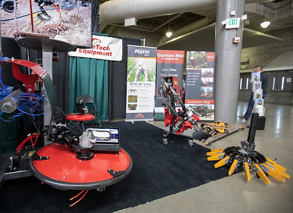 Weeding and defoliation equipment on display on the first day of the Washington State Tree Fruit Association's NW Hort Expo on Monday, Dec. 6, 2021 at the Yakima Valley SunDome in Yakima, Washington. (TJ Mullinax/Good Fruit Grower)