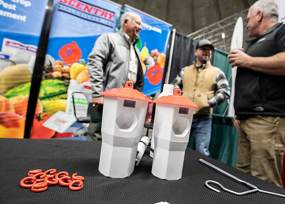 Automation isn’t just for robots, here, Scentry displays new pheromone puffers and PVC pheromone disruptors during the first day of the Washington State Tree Fruit Association's NW Hort Expo on Monday, December 6, 2021 at the Yakima Valley SunDome in Yakima, Washington. (TJ Mullinax/Good Fruit Grower)