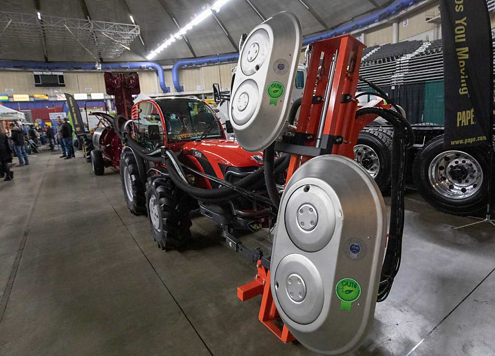 Air blast machines such as the Olmi leaf remover are one hand to see during the first day of the Washington State Tree Fruit Association's NW Hort Expo on Monday, December 6, 2021 at the Yakima Valley SunDome in Yakima, Washington. (TJ Mullinax/Good Fruit Grower)