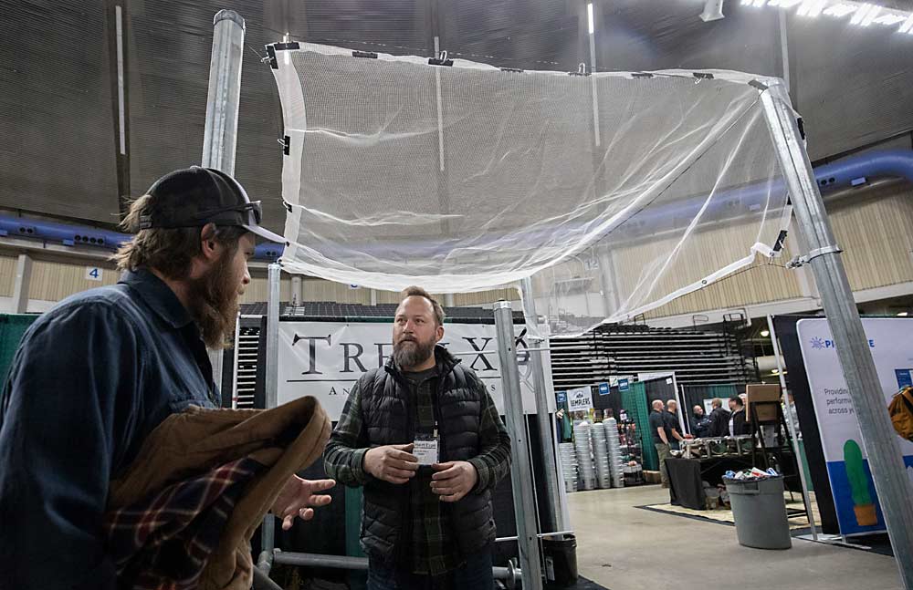 Netting systems such as this Trellix display is on hand to see during the first day of the Washington State Tree Fruit Association's NW Hort Expo on Monday, December 6, 2021 at the Yakima Valley SunDome in Yakima, Washington. (TJ Mullinax/Good Fruit Grower)