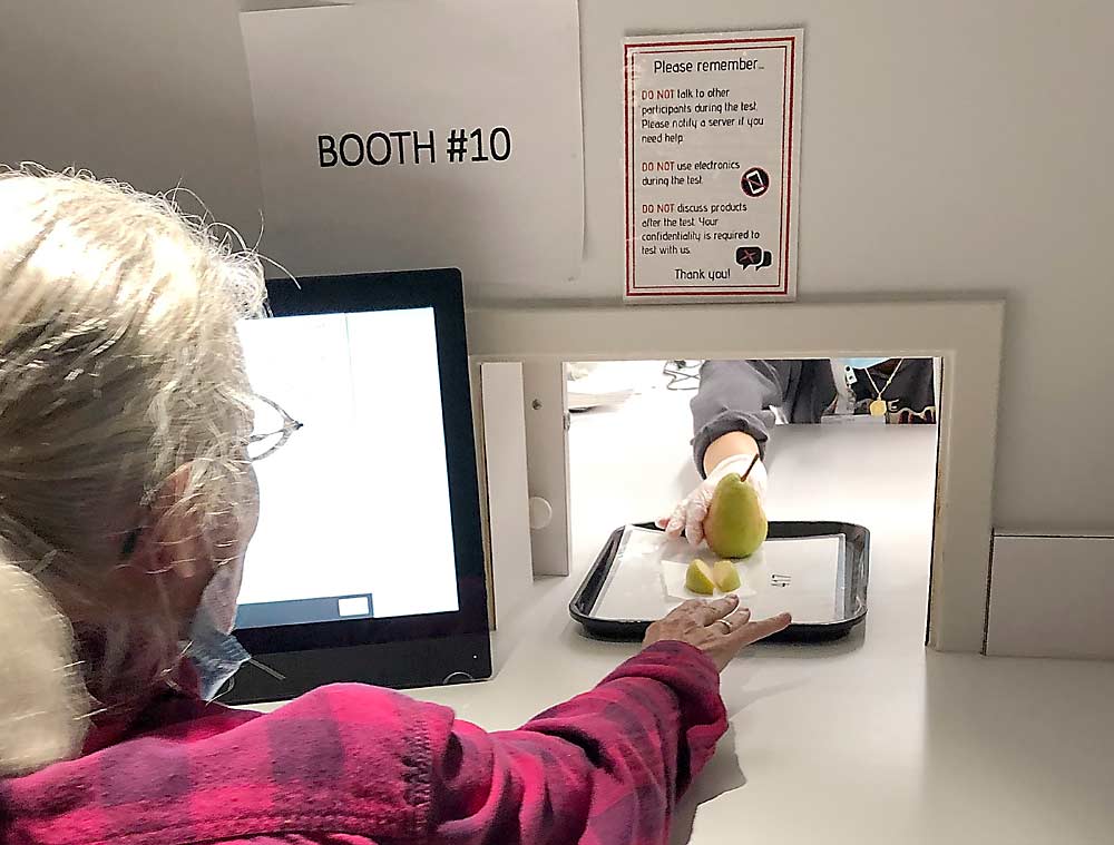 A self-identified pear fan tastes a sample during a 2021 consumer preference study at the Oregon State University Food Innovation Center in Portland. (Courtesy Ann Colonna/Oregon State University)