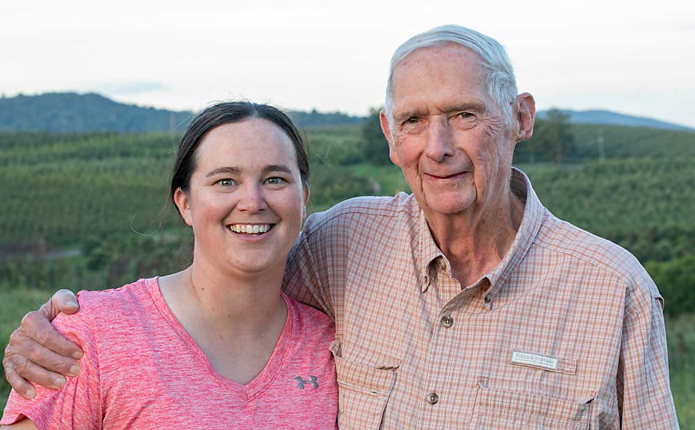 Sarah Zost at Bonnie Brae Fruit Farms in Gardners, Pennsylvania, with her grandfather, Mac Lott. Her grandfather wasn’t sold on Ambrosia at first, but he’s starting to come around, Zost said. (TJ Mullinax/Good Fruit Grower)